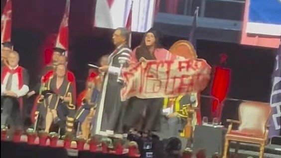 Canada university student makes spitting gesture at teachers, others cheer her