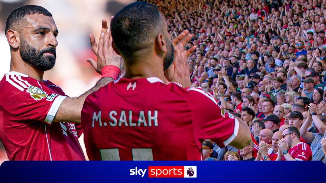 Mohamed Salah applauds Liverpool fans at Anfield after leaving the pitch with injury
